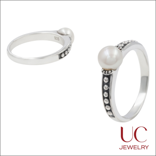 A sophisticated take on the June birthstone, this ring showcases a lustrous white pearl set on a handcrafted beaded band. Made with high-quality 925 silver, its oxidized finish adds depth and a touch of antique charm to any jewelry collection.