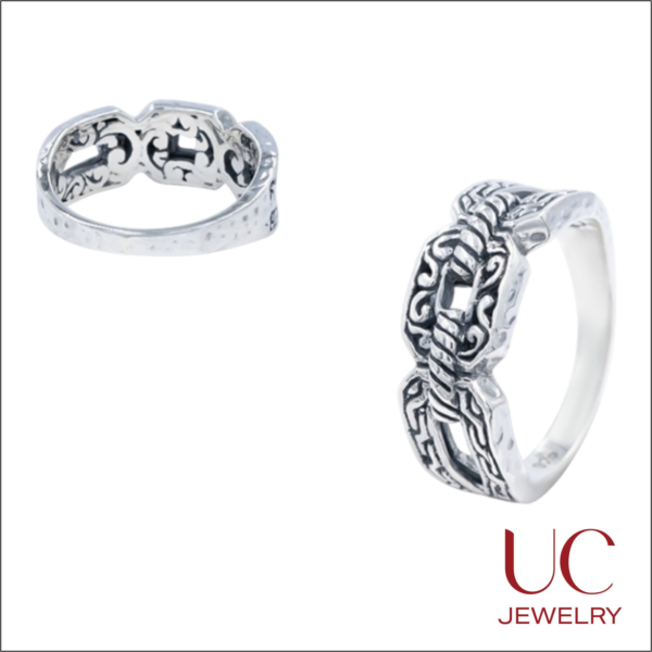 Elevate your style with UC Jewelry's Oxidized Filigree Ring. Featuring handcrafted 925 silver scrollwork and a textured hammered band, this Balinese-style piece is a timeless statement. Enjoy a comfort-fit design with artisan detail.