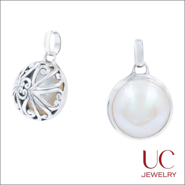 Elevate your style with the UC Jewelry Reversible Pearl Pendant. A classic white pearl meets intricate silver filigree in one stunning, dual-sided design. Experience luxury craftsmanship today.