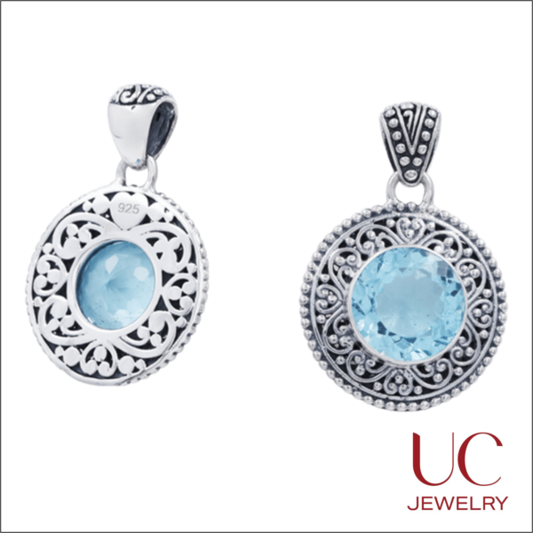This 925 Sterling Silver Blue Topaz Pendant combines artisan craftsmanship with timeless elegance. Featuring a vibrant, round-cut blue gemstone framed by intricate Bali-style filigree and delicate granulation, this handcrafted piece offers a stunning boho-chic aesthetic. The ornate, cut-out scrollwork on the reverse ensures a high-quality finish from every angle. Key Features: Gemstone: Genuine Blue Topaz (Round Brilliant Cut) Metal: Solid .925 Sterling Silver (Oxidized Finish) Style: Traditional Filigree & Granulation Brand: UC Jewelry