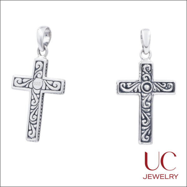 This 925 Sterling Silver Filigree Cross Pendant features intricate, oxidized scrollwork that creates a striking vintage aesthetic. Product Overview Intricate Artistry: Deeply embossed vine patterns with a high-contrast oxidized finish for a timeless, "heirloom" look. Premium Quality: Crafted from genuine .925 sterling silver, stamped for authenticity on the reverse. Elegant Finish: Polished edges and a smooth central stud offer a sophisticated balance to the textured filigree. Versatile Style: A symbolic piece of faith jewelry suitable for both daily wear and special occasions.