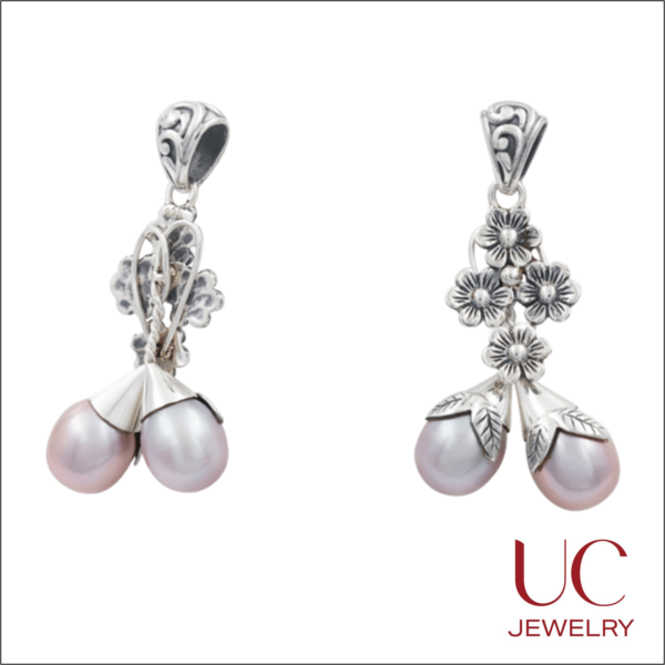 Capture the essence of nature with these Sterling Silver Lavender Pearl Floral Drop Earrings. These whimsical dangles feature a delicate cluster of four silver blossoms that give way to two teardrop-shaped freshwater pearls nestled in intricate, hand-finished leaf caps. Crafted from high-quality oxidized silver for a vintage-inspired look, they offer a perfect balance of romantic elegance and botanical detail. Whether you're dressing up for a wedding or adding a soft touch to your daily style, these unique earrings are a timeless tribute to the beauty of the natural world.