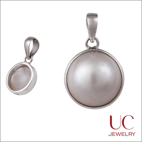 Discover the glow of our iridescent cabochon pendants. Sleek silver settings meet natural luster in these versatile circular charms. Perfect for everyday layering!