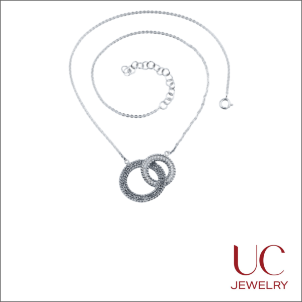 Elevate your jewelry collection with our 925 Sterling Silver Double Hoop Pendant. This unique piece blends vintage Balinese-style filigree with modern brilliance. Handcrafted textures meet shimmering stones on a delicate, adjustable cable chain. Stylish, versatile, and expertly finished.